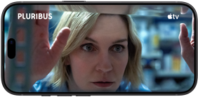 iPhone 18 Pro, landscape mode, displaying a close-up of a woman looking through a window. Series title: Pluribus